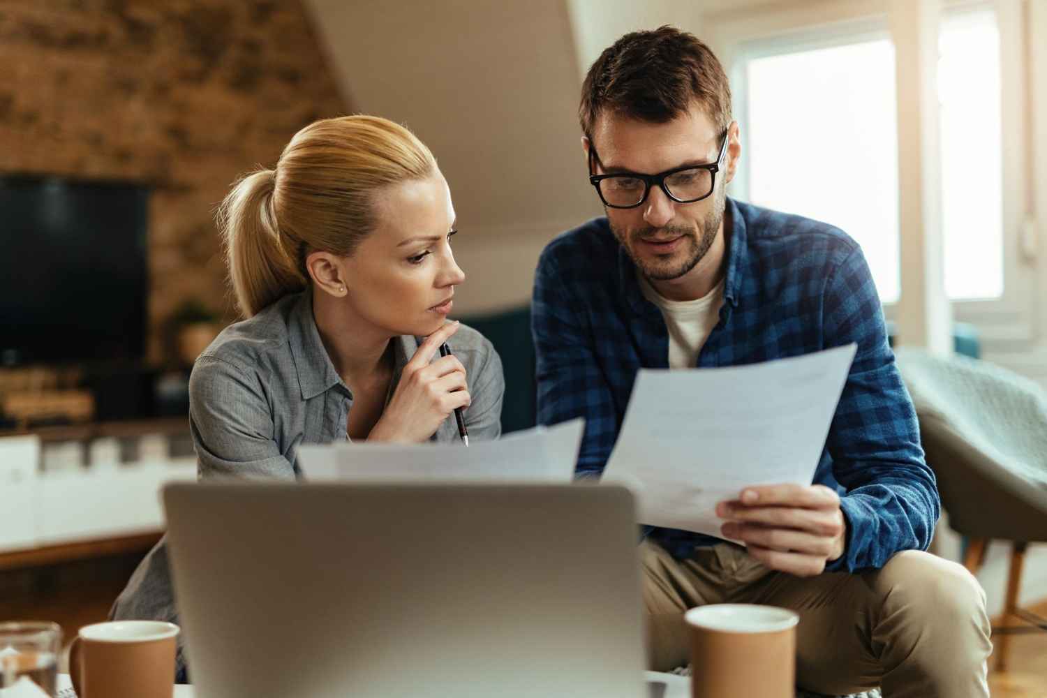 Couple reviewing documents before buying property in Spain